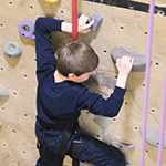 Boy on climbing wall