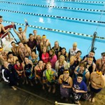 Adaptive swim team participants next to pool