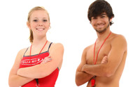 Boy and girl teen lifeguards in uniform over white background