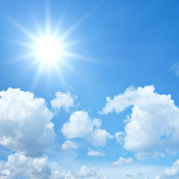 Sun and clouds with a blue sky