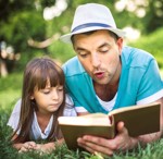 Man reading to girl