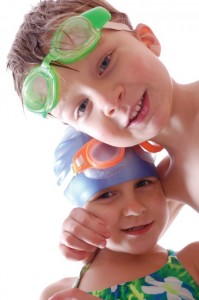 Image of two children with swim goggles