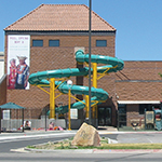 The large green slide seen on the outside of the Legacy Center