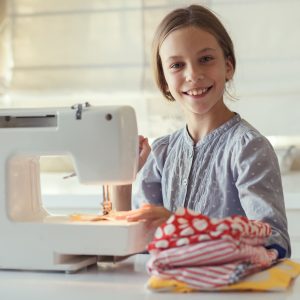 Girl using a sewing machine