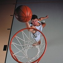 Man slam dunking